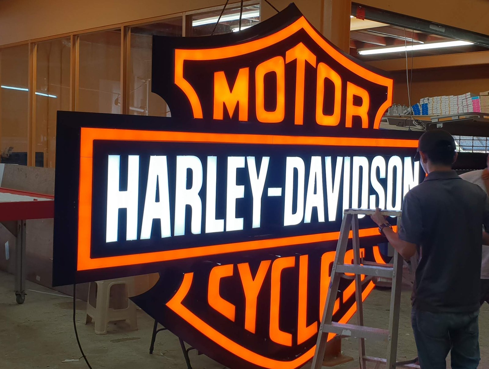 Illuminated dimensional sign under assembly in the Sign King shop